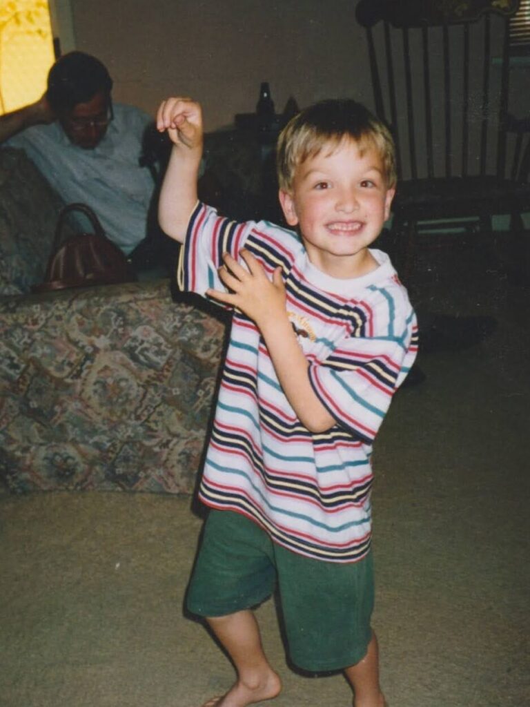 Christopher as a young boy, pretending to be a monkey